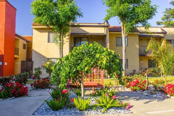 Well-maintained outdoor space with colorful flowers and trees