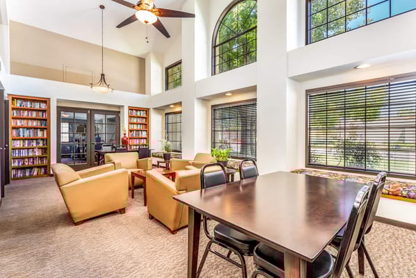 Bright common area with seating and bookshelves