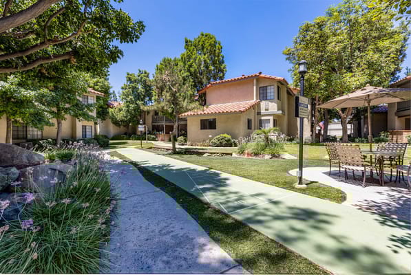 Outdoor space with gardens and seating area