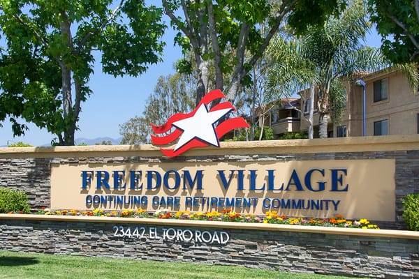 Entrance sign for Freedom Village Retirement Community