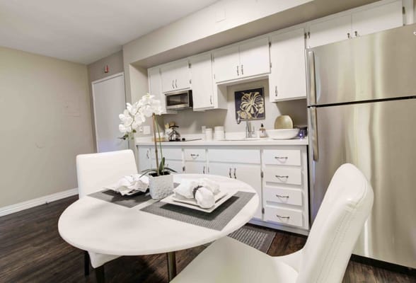 Bright interior view of a kitchenette with dining area