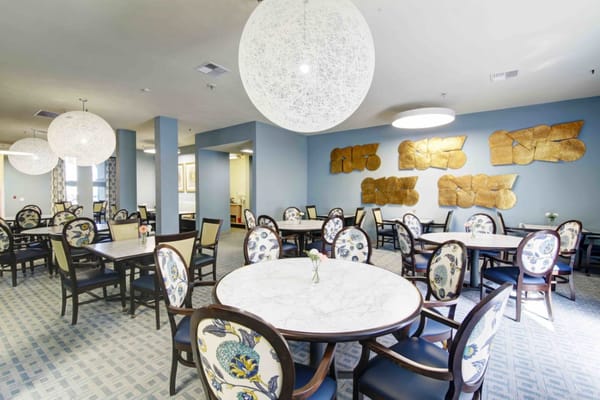 Bright dining room with elegant decor and tables