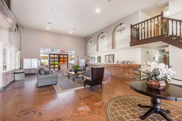 Spacious lobby area of Santiago Villas with seating and mailboxes