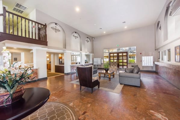 Cozy lobby area with seating and a reception desk