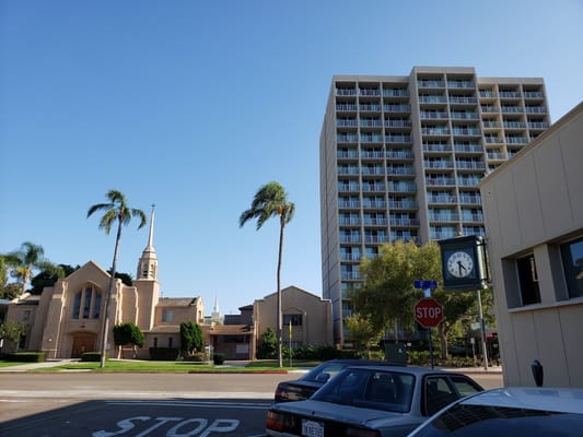 Exterior view of a senior living facility and church