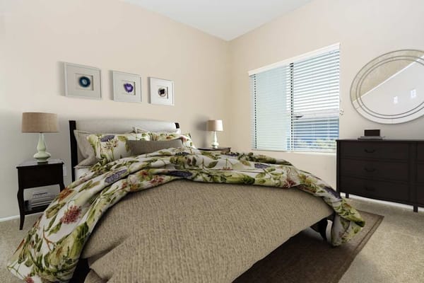 A well-decorated bedroom in a senior living facility