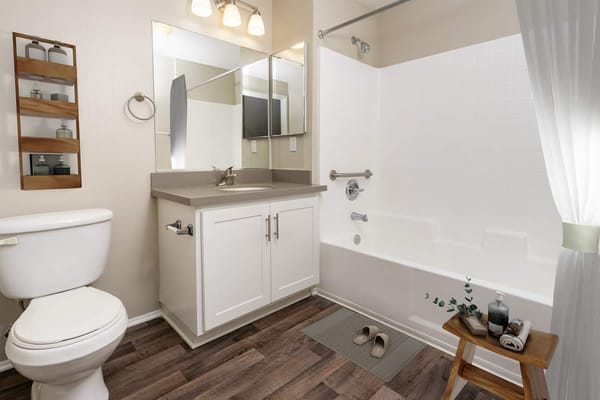Bright, clean bathroom with modern amenities