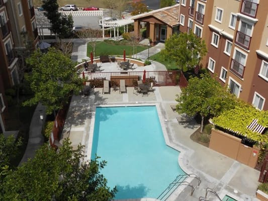 Aerial view of a swimming pool and outdoor seating area