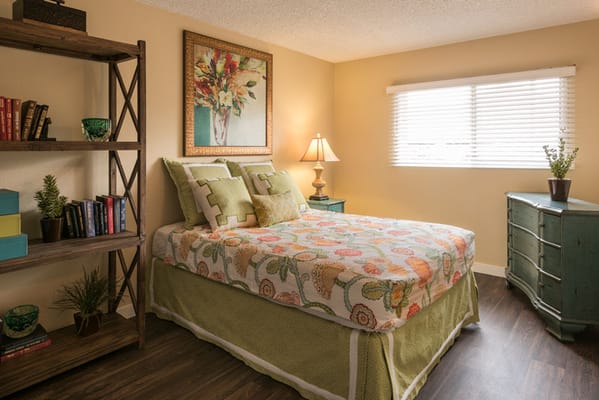Cozy resident room with floral decor and furniture