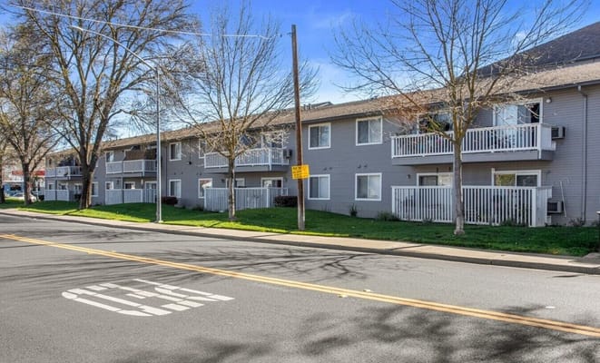Exterior of La Loma Senior Apartments showing balconies and landscaping