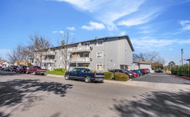 Exterior of La Loma Senior Apartments with parking area