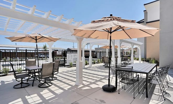 Outdoor dining area with umbrellas and seating