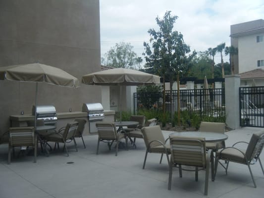Patio area with tables and umbrellas outside