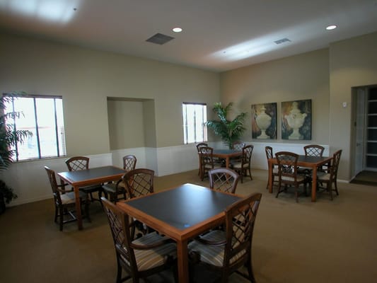 Bright common area with tables and chairs