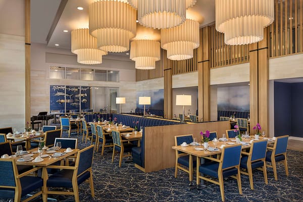 Elegant dining room with tables set for meals