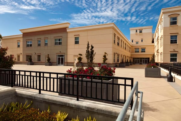 Exterior view of Sycamore Senior Village with landscape