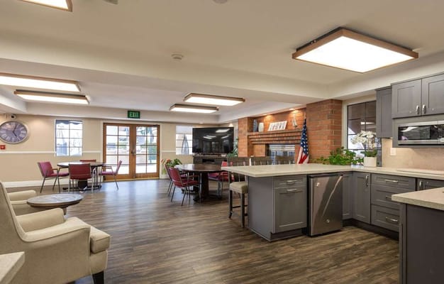Interior view of a common area with seating and a fireplace