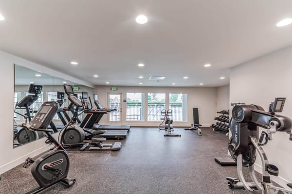 A modern fitness room with exercise equipment