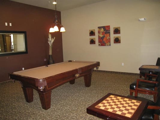 Interior common area with a pool table and seating