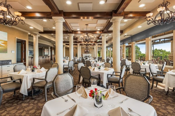 Dining room with tables set for a meal at Varenna at Fountaingrove