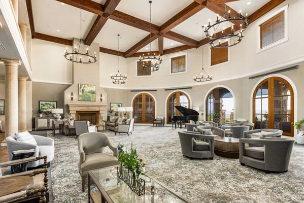 Elegant living room with seating and fireplace at Varenna at Fountaingrove.