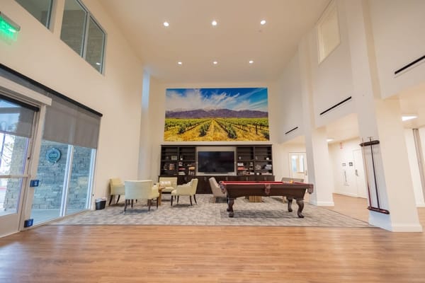 Interior view of a common area with seating and art