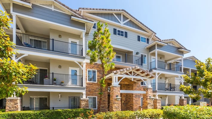 Exterior view of a senior living facility with balconies