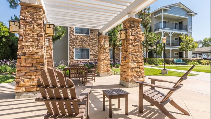 Outdoor seating area with a stone pergola