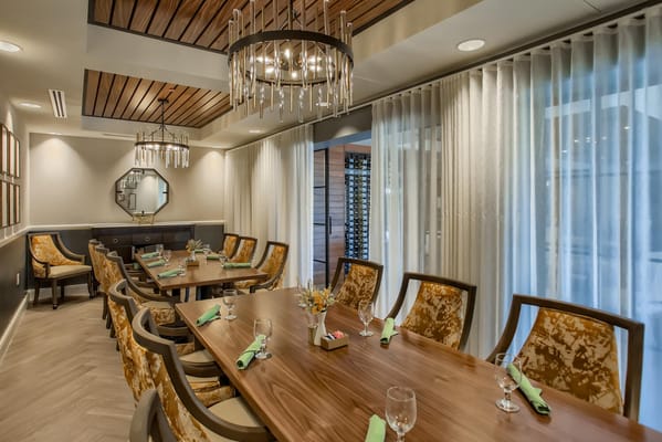 Elegant dining room setup with decorative chairs and tableware