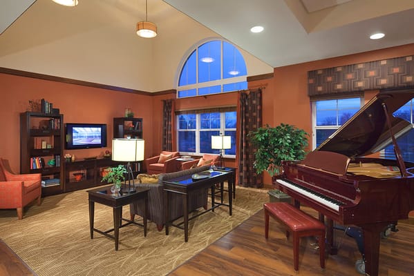 Cozy common area with piano and seating