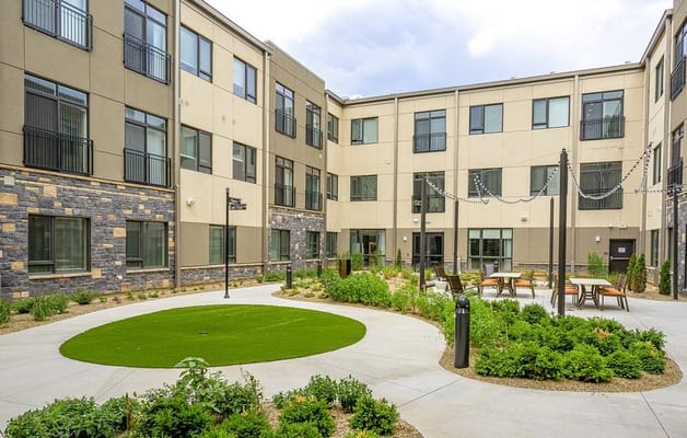 Outdoor courtyard with seating and landscaping