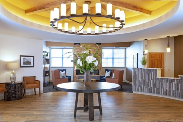 Bright lobby area with floral centerpiece and seating