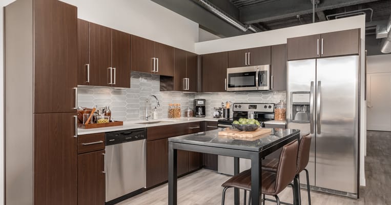Modern kitchen interior with appliances and seating
