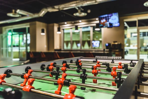 Close-up of a foosball table in a community game room