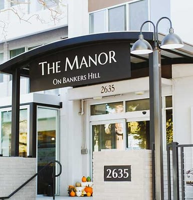 Entrance of The Manor with signage
