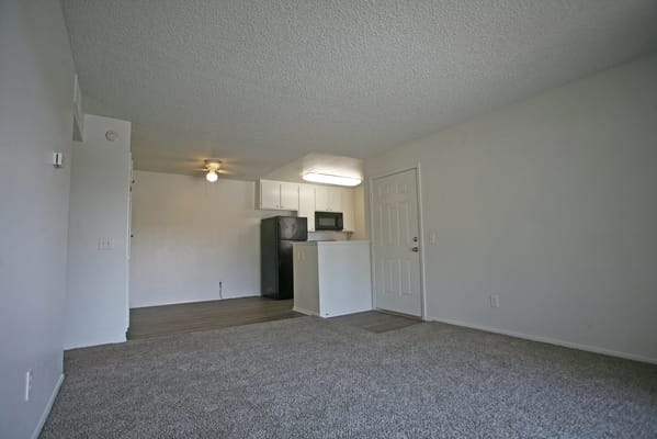 Bright, empty living room space in an apartment