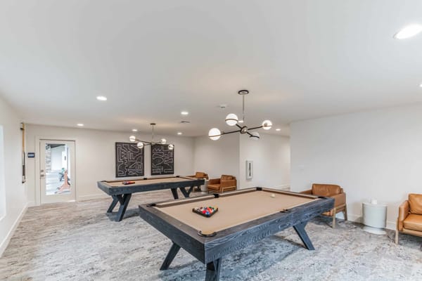 Interior view of a common area with pool tables