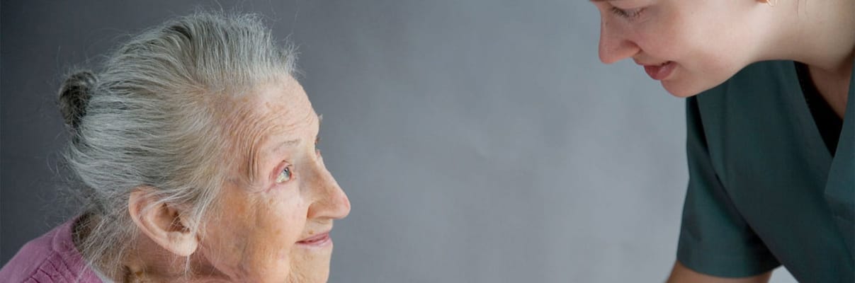 Caregiver interacting with a senior resident