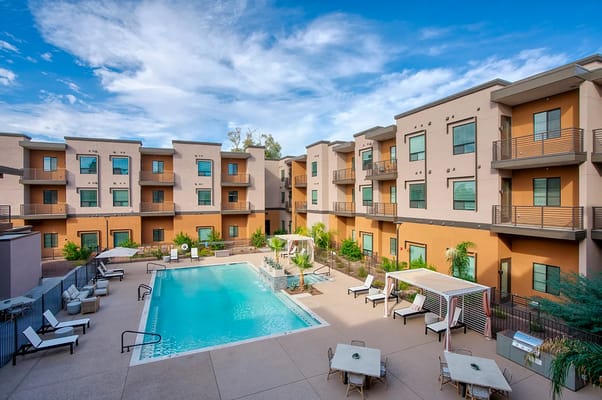 Outdoor view of a residential courtyard with a pool