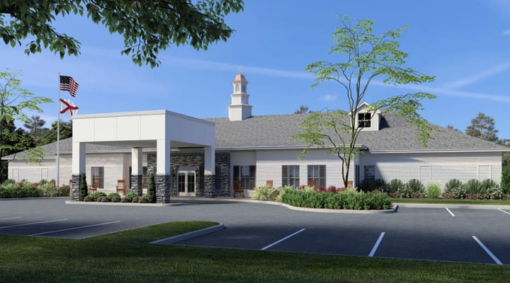 Exterior view of Carillon Oaks facility showing entrance and landscaping