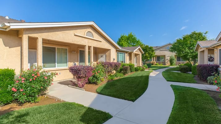 Clear view of the exterior landscaped pathways and residences