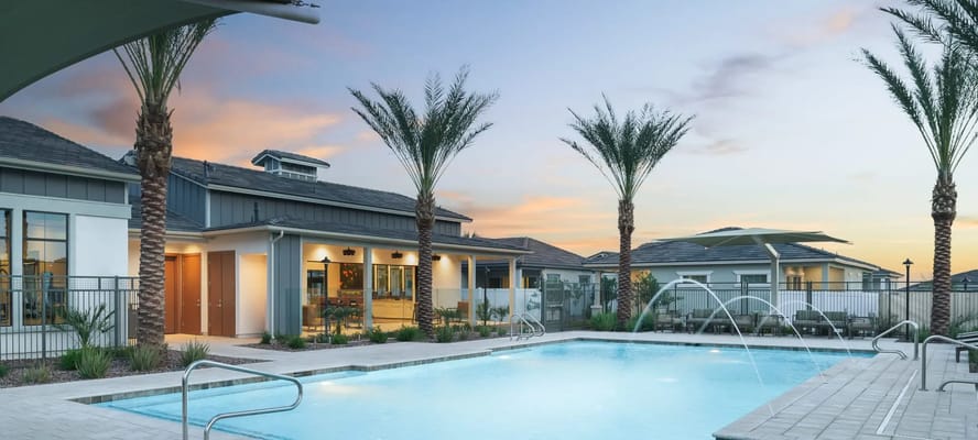 Outdoor pool with palm trees at Arrebol Villas