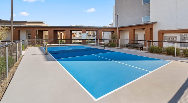 Outdoor pickleball court with blue surface