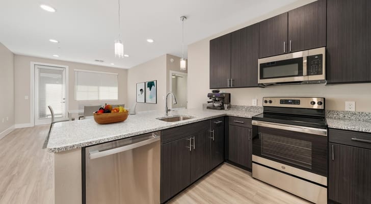 Modern kitchen interior with appliances and fruit bowl