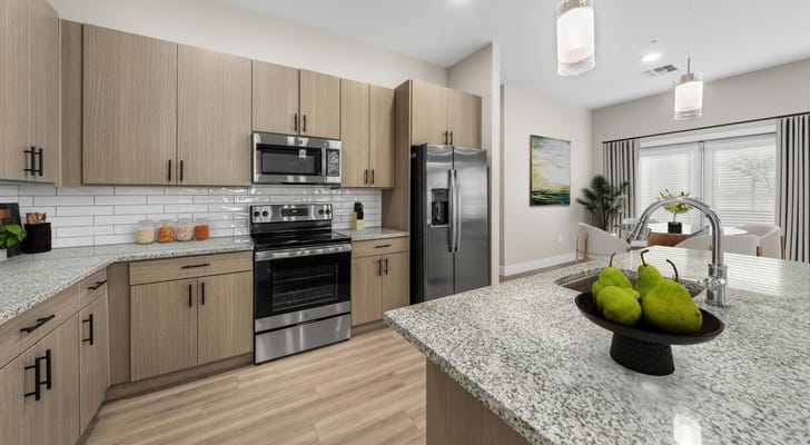 Modern kitchen with granite countertops and stainless steel appliances