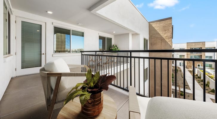 Modern meeting space with a balcony overlooking gardens