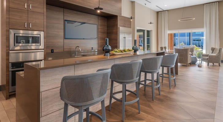 Modern common area with a kitchen island and seating