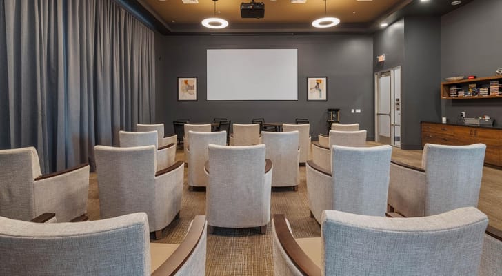 Modern movie theater-style seating in a common area