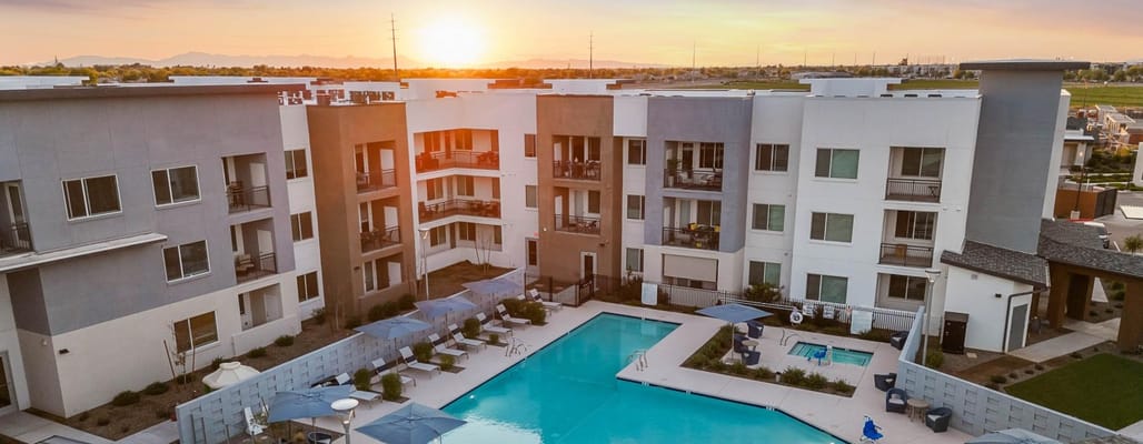 Aerial view of a senior living facility with pool