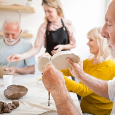 Residents participating in a pottery activity at the facility